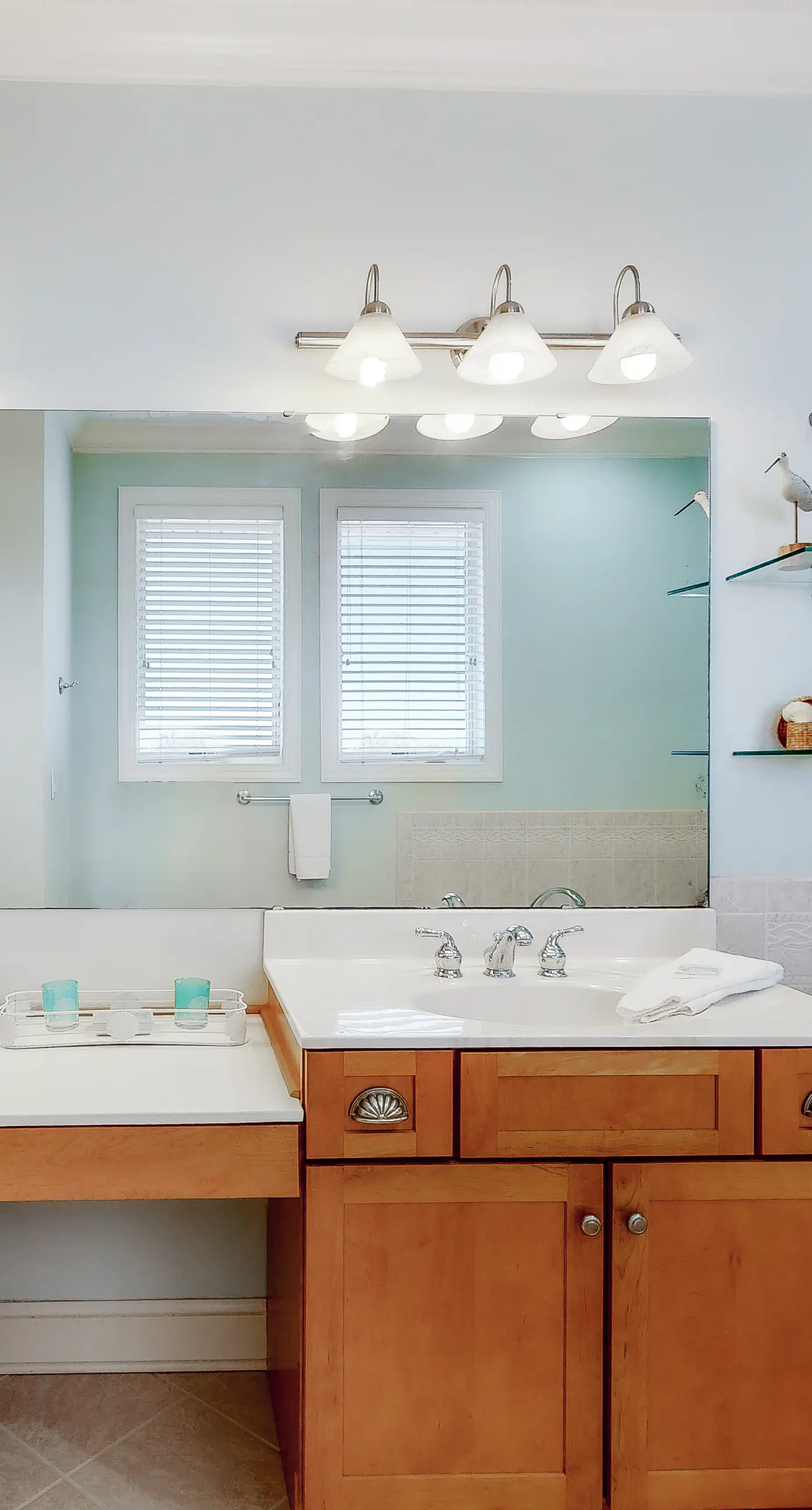 Beachfront home with a porch, washer/dryer, outdoor shower, & AC