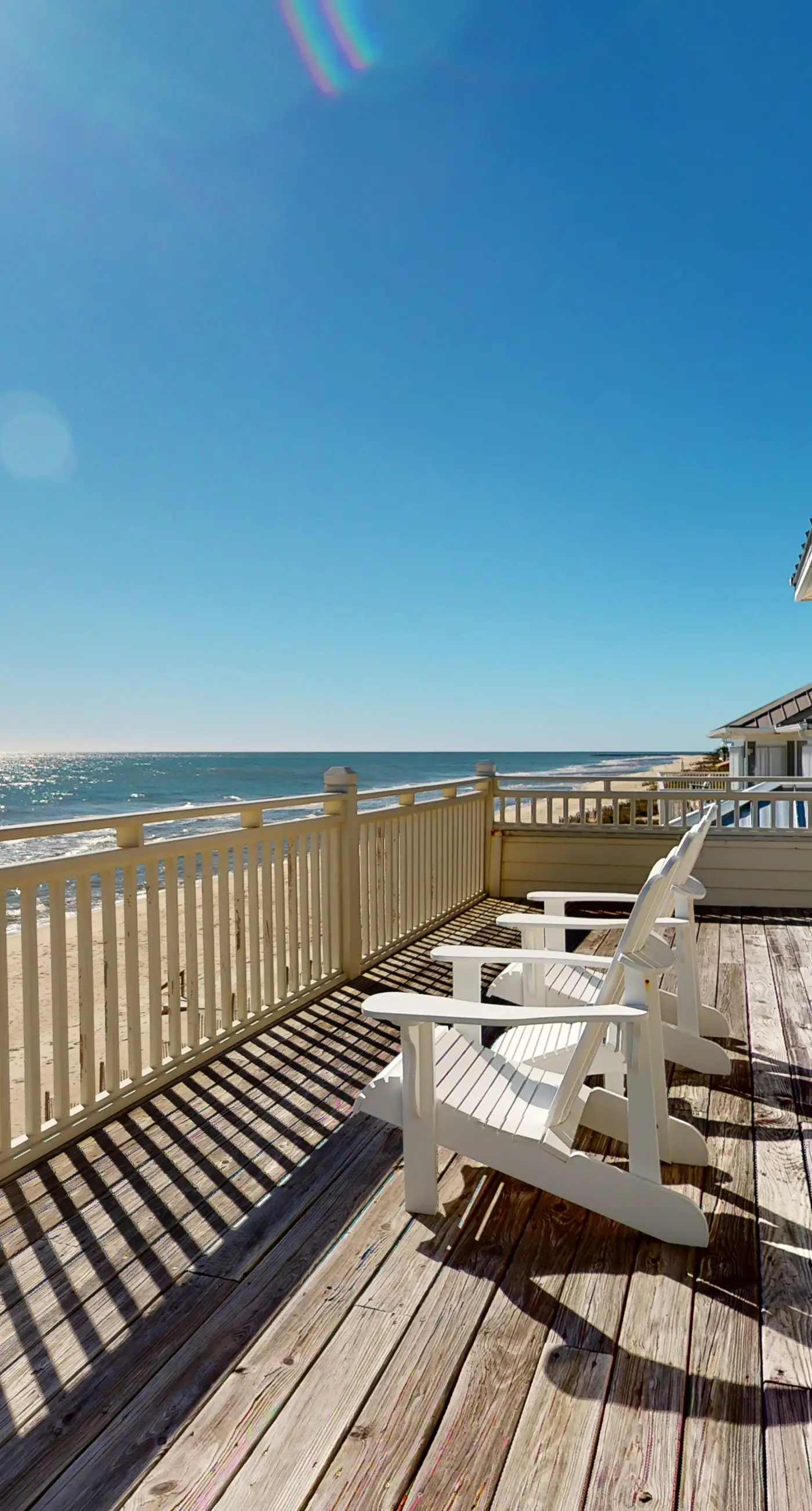 Beachfront home with a porch, washer/dryer, outdoor shower, & AC