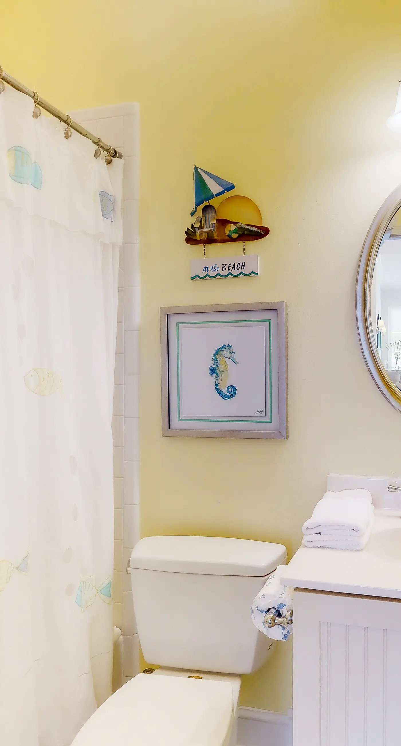 Beachfront home with a porch, washer/dryer, outdoor shower, & AC