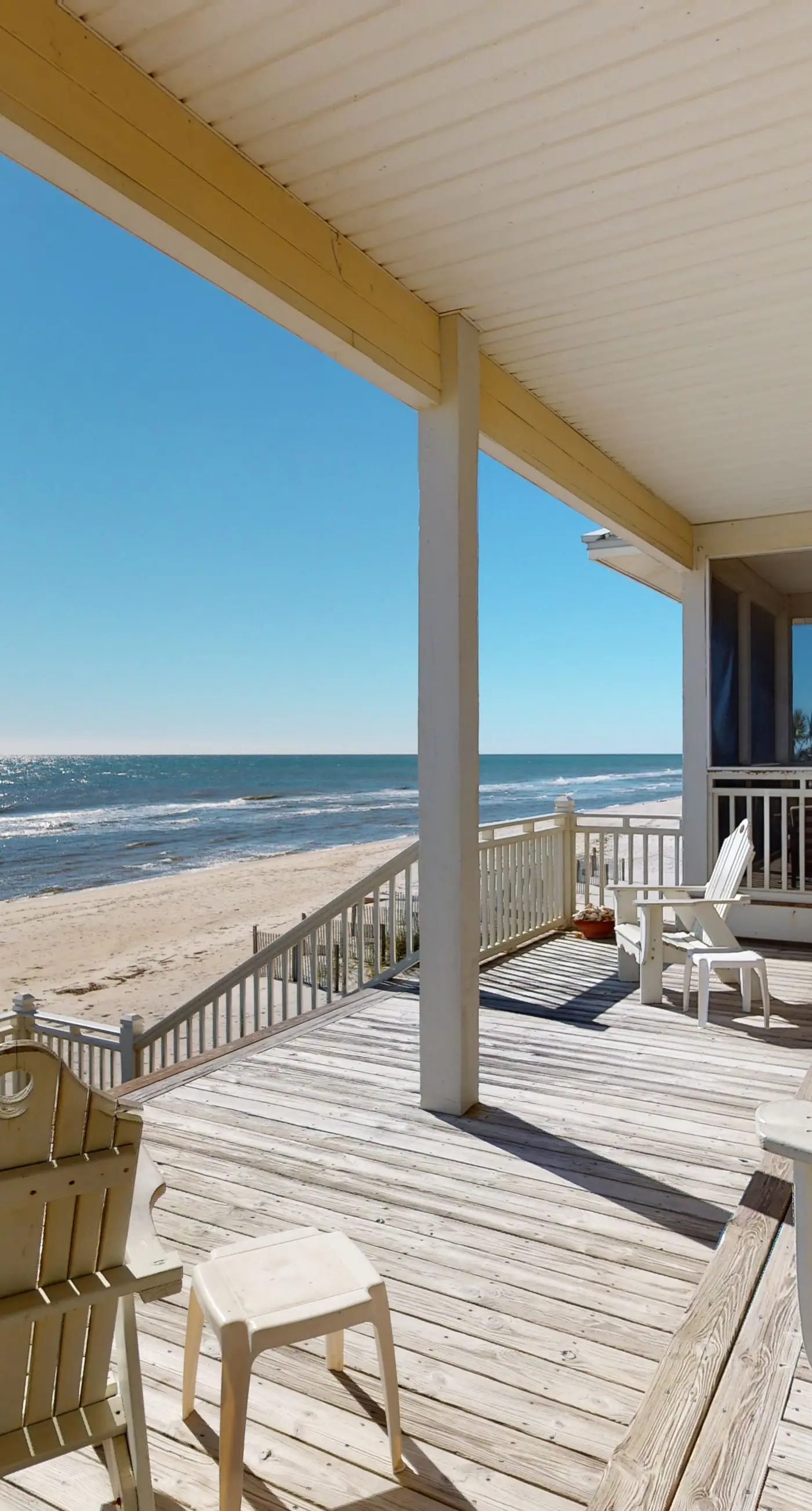 Beachfront home with a porch, washer/dryer, outdoor shower, & AC