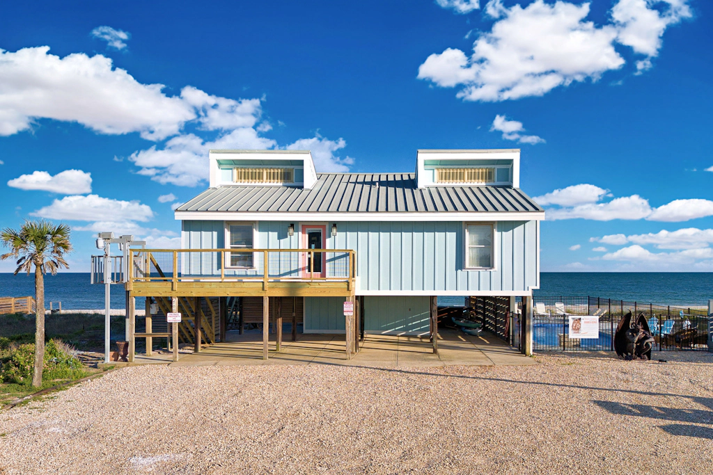 Dog-friendly with Gulf view, pool, balcony, deck, fireplace, central AC, & W&D