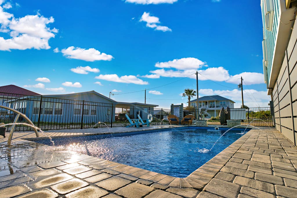 Dog-friendly with Gulf view, pool, balcony, deck, fireplace, central AC, & W&D