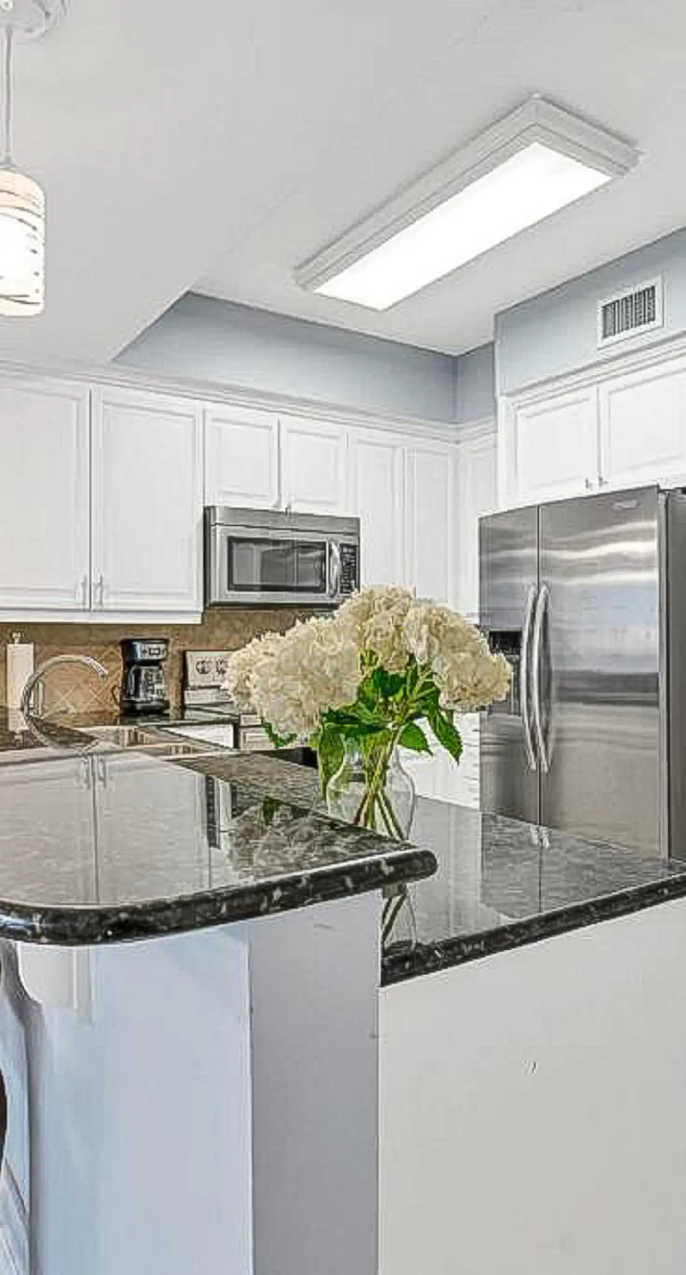 Luxury condo with on-site pools and a convenient central location