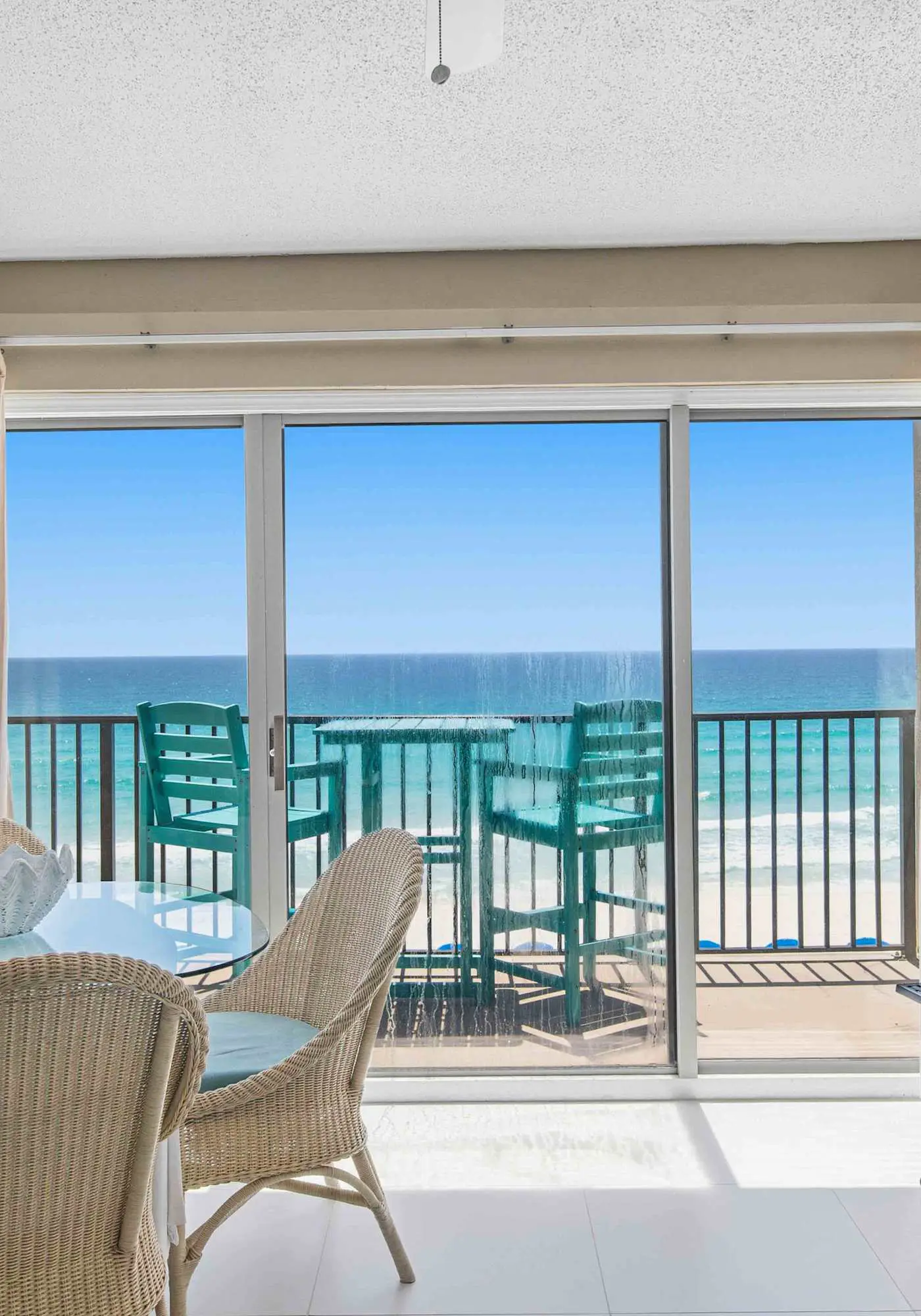 Spacious beachfront condo with full kitchen, shared pool and beach access