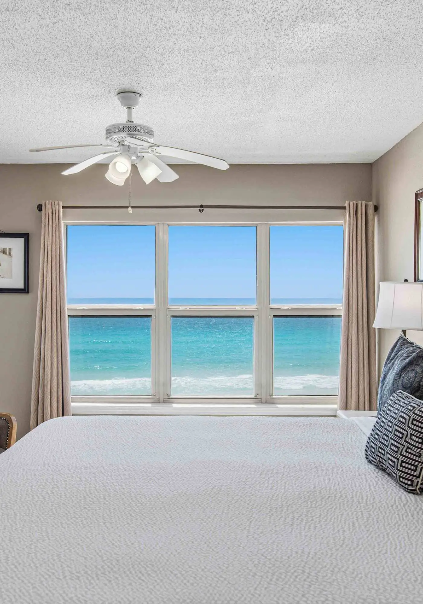 Spacious beachfront condo with full kitchen, shared pool and beach access
