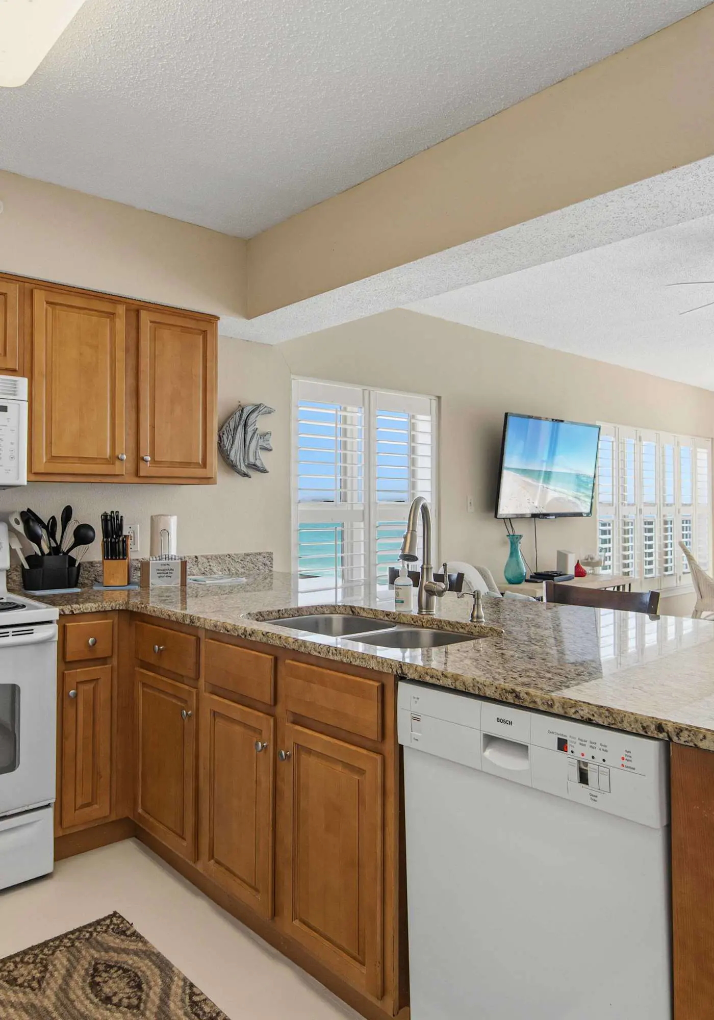 Spacious beachfront condo with full kitchen, shared pool and beach access