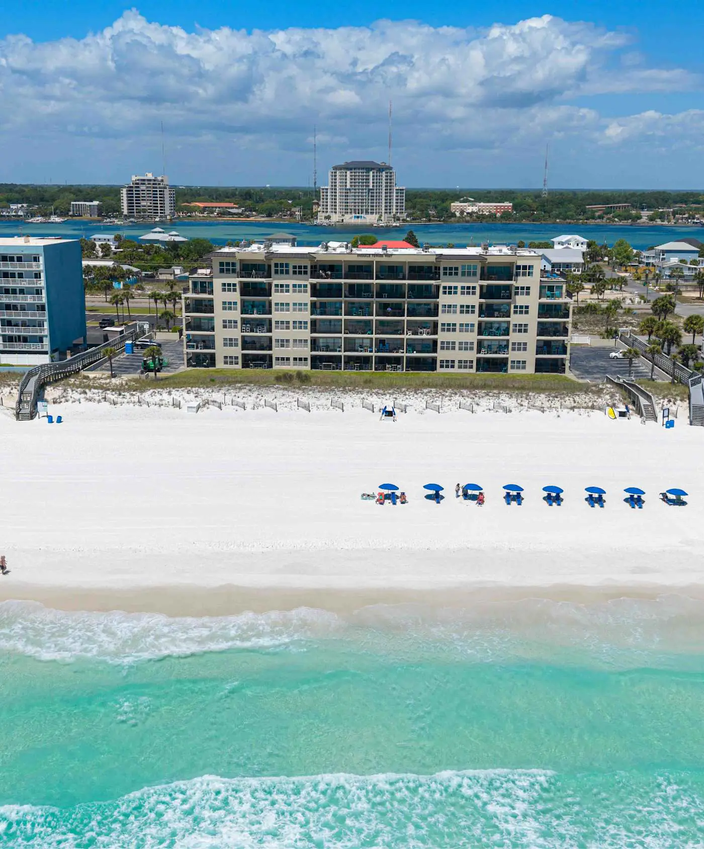 Spacious beachfront condo with full kitchen, shared pool and beach access