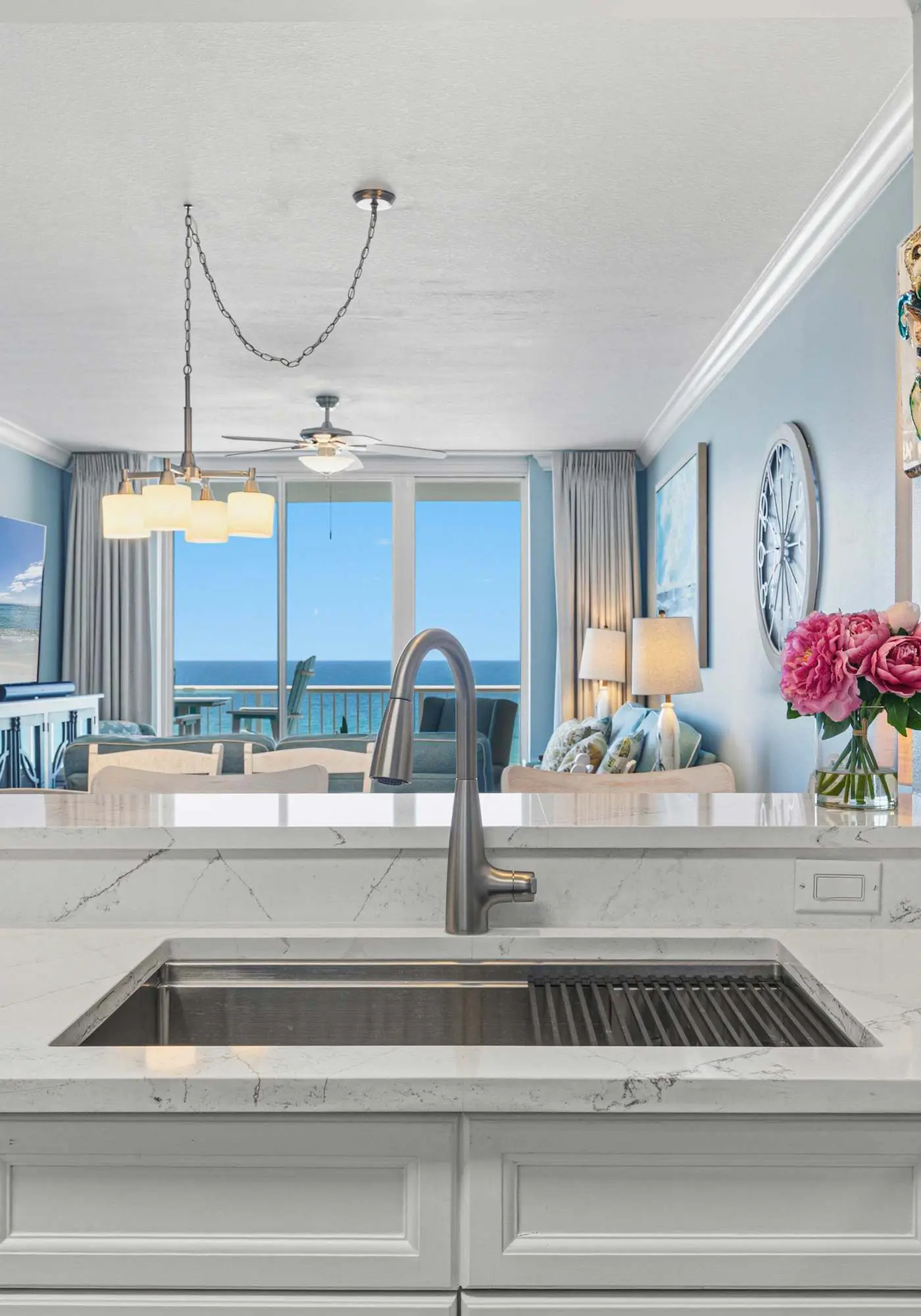 Enchanting oceanfront condo with pool, balcony, fitness area, & washer&dryer