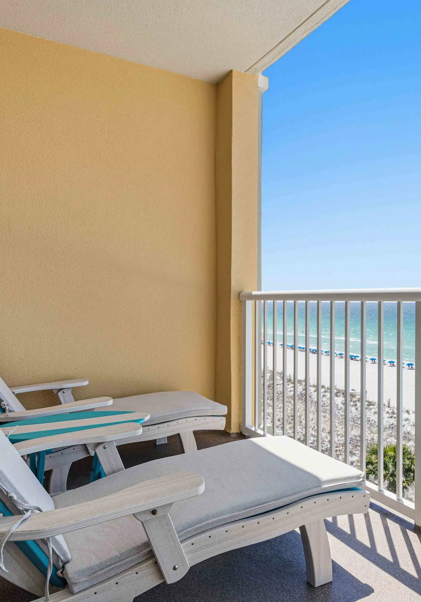 Enchanting oceanfront condo with pool, balcony, fitness area, & washer&dryer