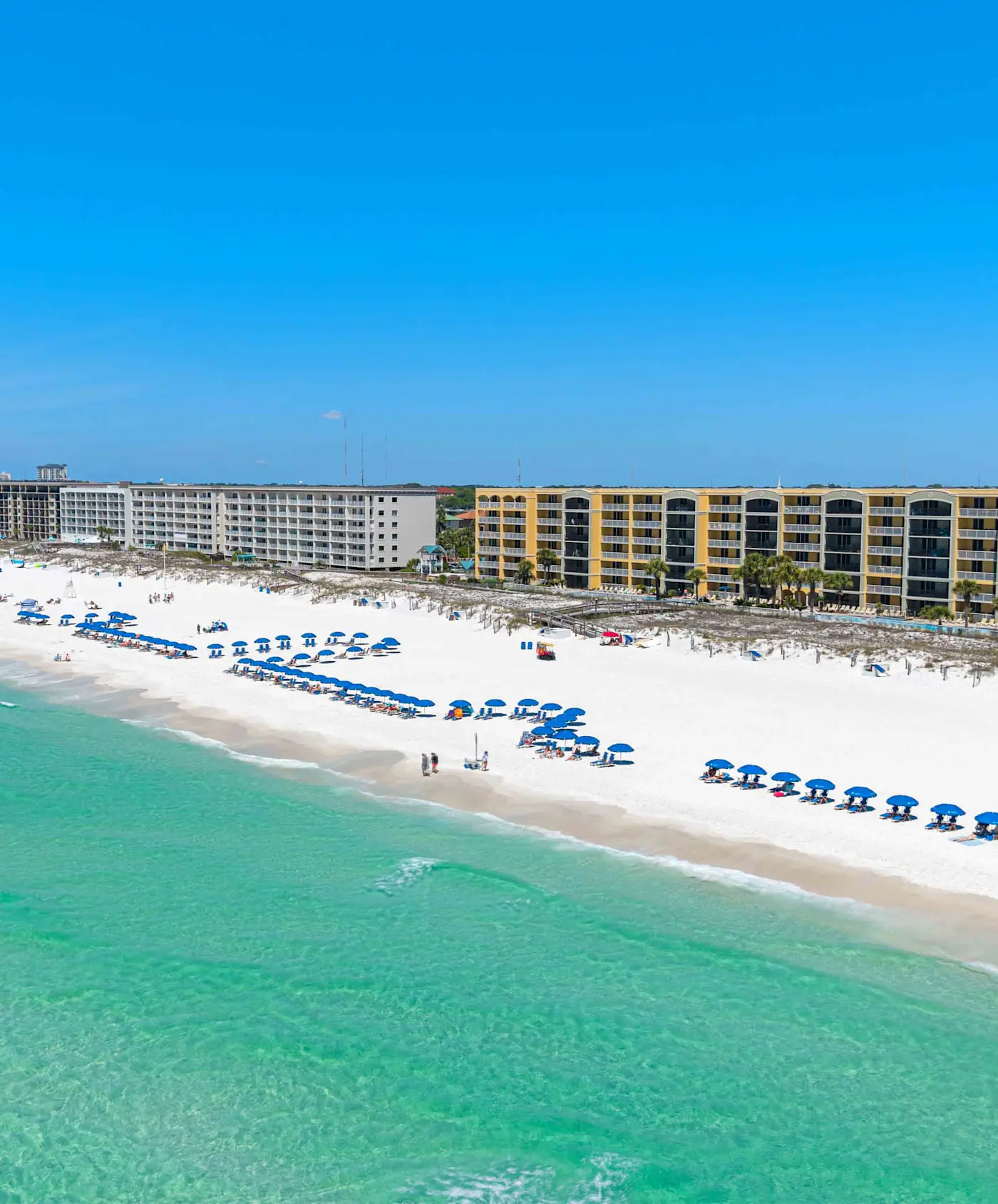 Enchanting oceanfront condo with pool, balcony, fitness area, & washer&dryer