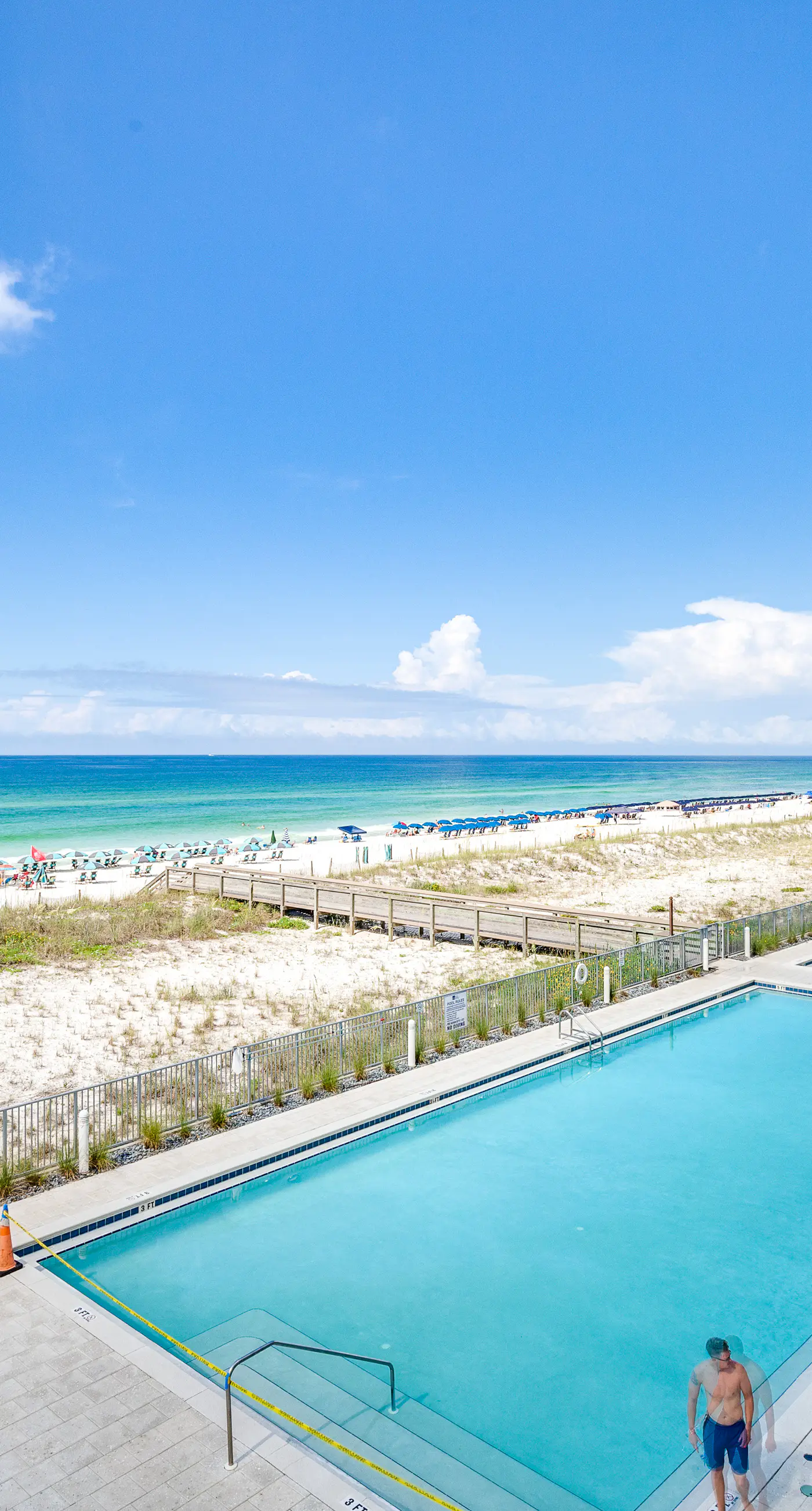 Third-floor, Gulf-view condo with pool and hot tub access, central AC, & W&D