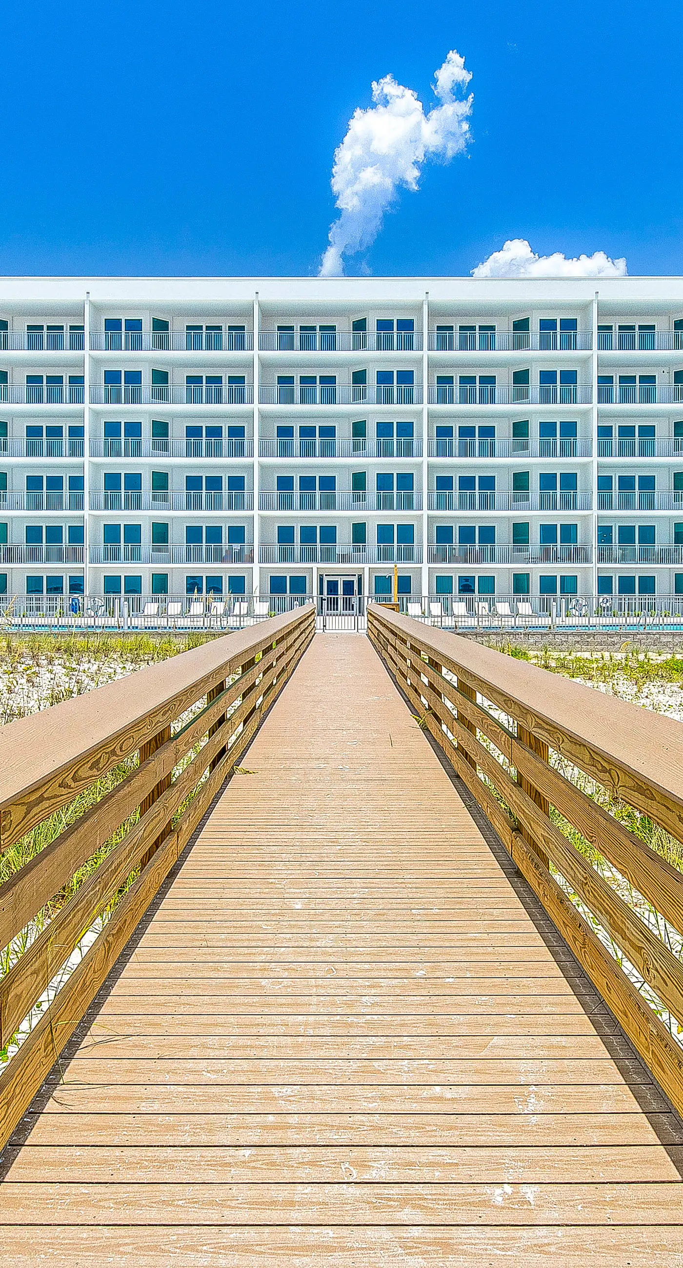 Third-floor, Gulf-view condo with pool and hot tub access, central AC, & W&D