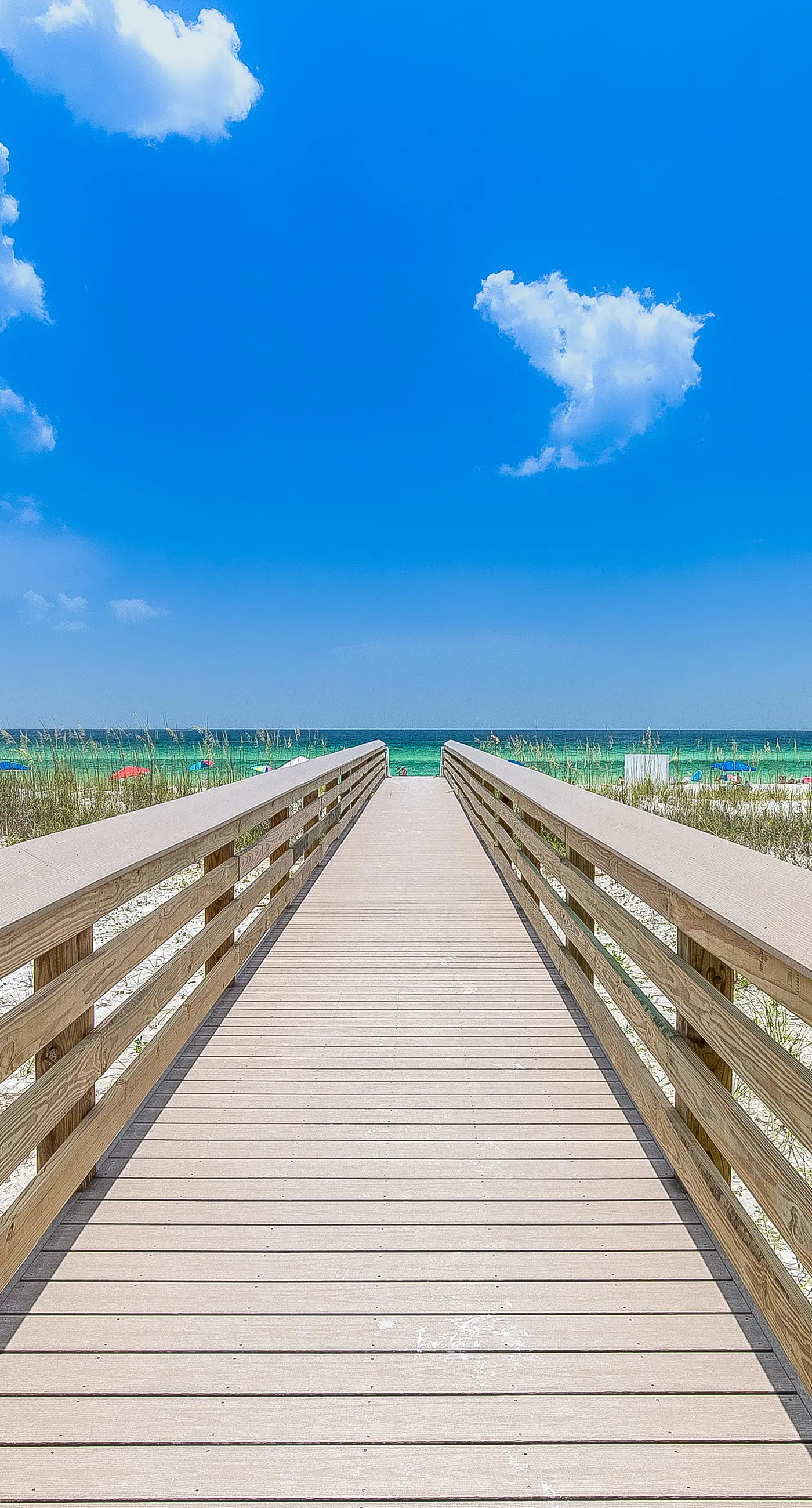 Third-floor, Gulf-view condo with pool and hot tub access, central AC, & W&D