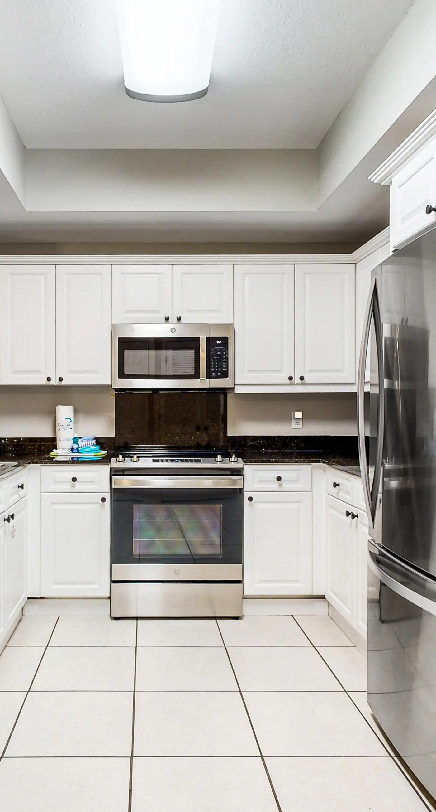 Gulf-front condo with washer/dryer, pools, hot tub, fitness room, & beach access