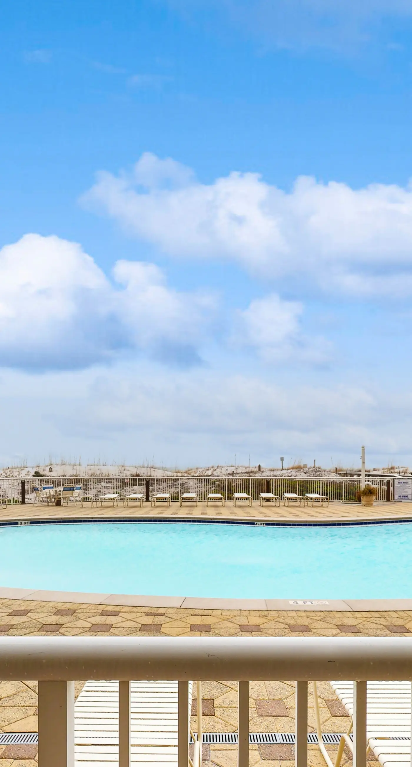 Gulf-front condo with washer/dryer, pools, hot tub, fitness room, & beach access