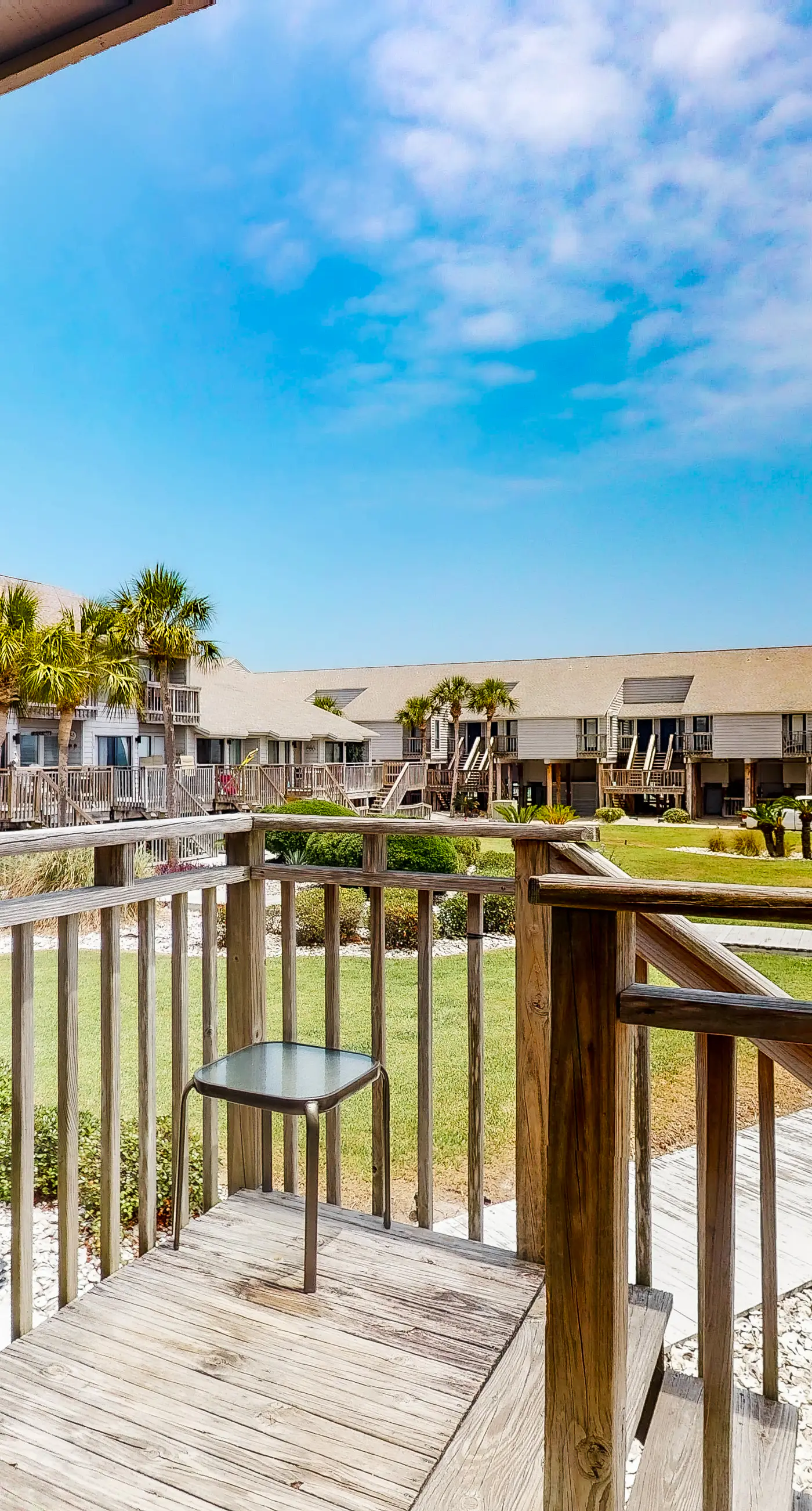 Poolside dog-friendly townhouse with partial Gulf views, on-site pool & grills