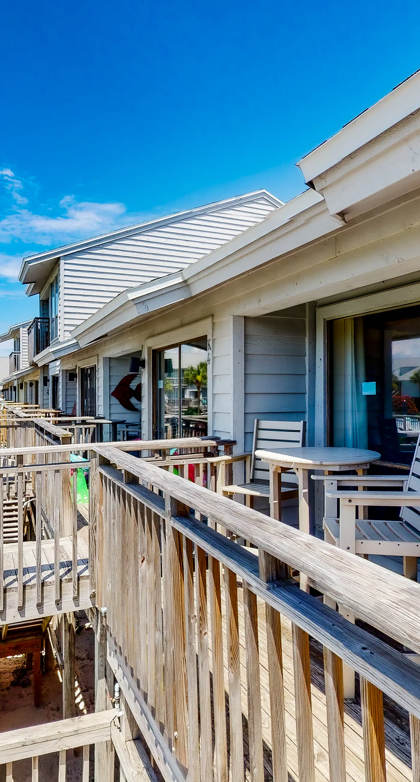 Poolside dog-friendly townhouse with partial Gulf views, on-site pool & grills