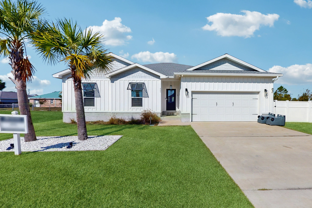 Dog friendly, coastal retreat with fenced yard, private pool, golf cart and cove