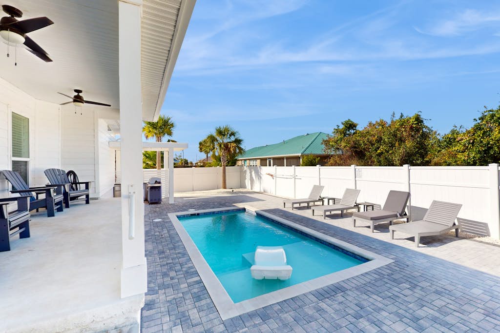 Dog friendly, coastal retreat with fenced yard, private pool, golf cart and cove