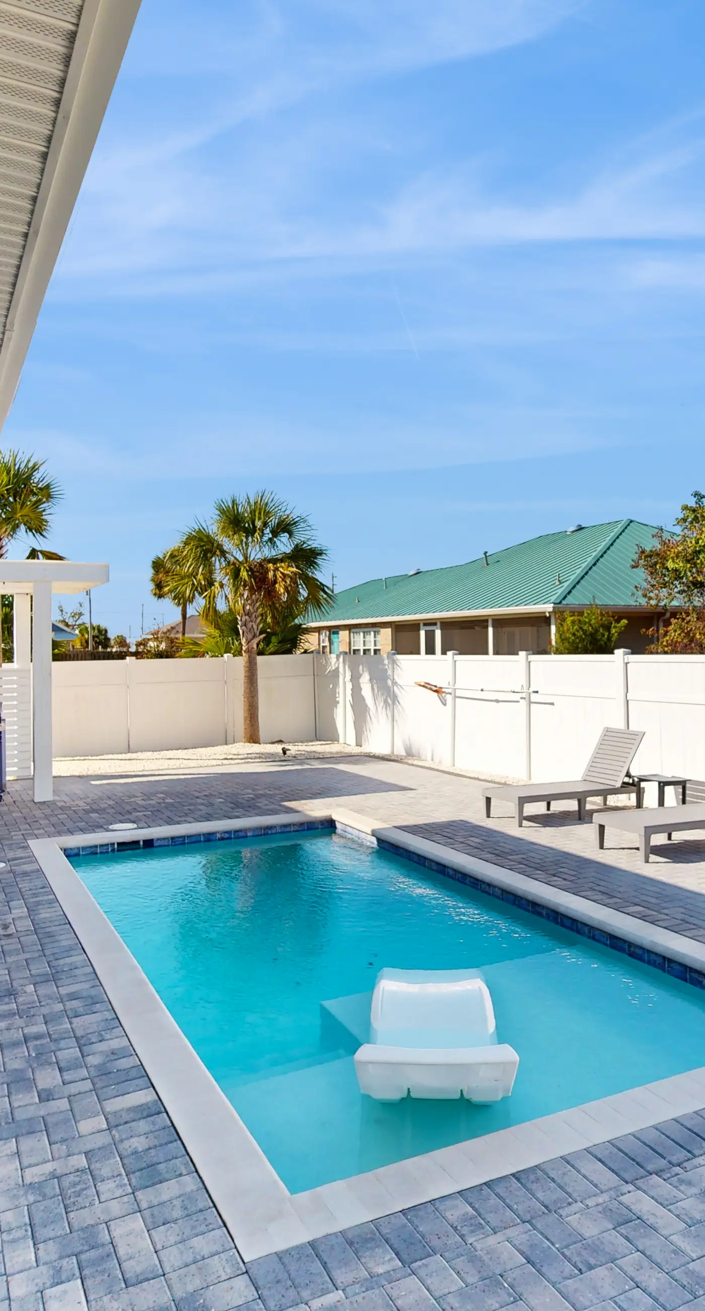 Dog friendly, coastal retreat with fenced yard, private pool, golf cart and cove