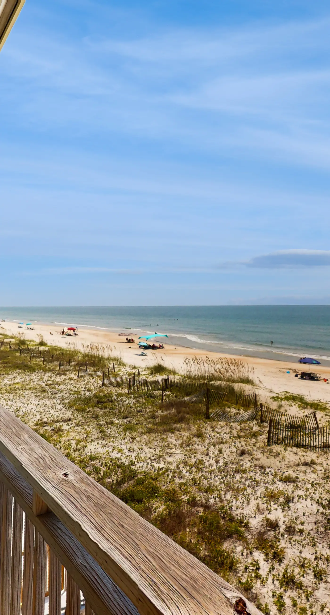 Beachfront East End townhouse with beach views, deck, on-site pool & grills