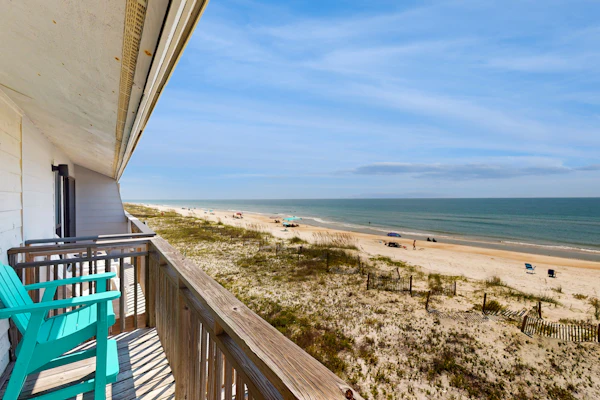 Beachfront East End townhouse with beach views, deck, on-site pool & grills
