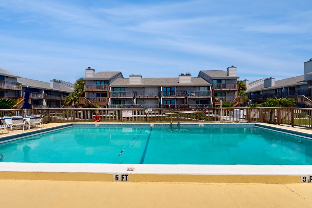 Beachfront East End townhouse with beach views, deck, on-site pool & grills
