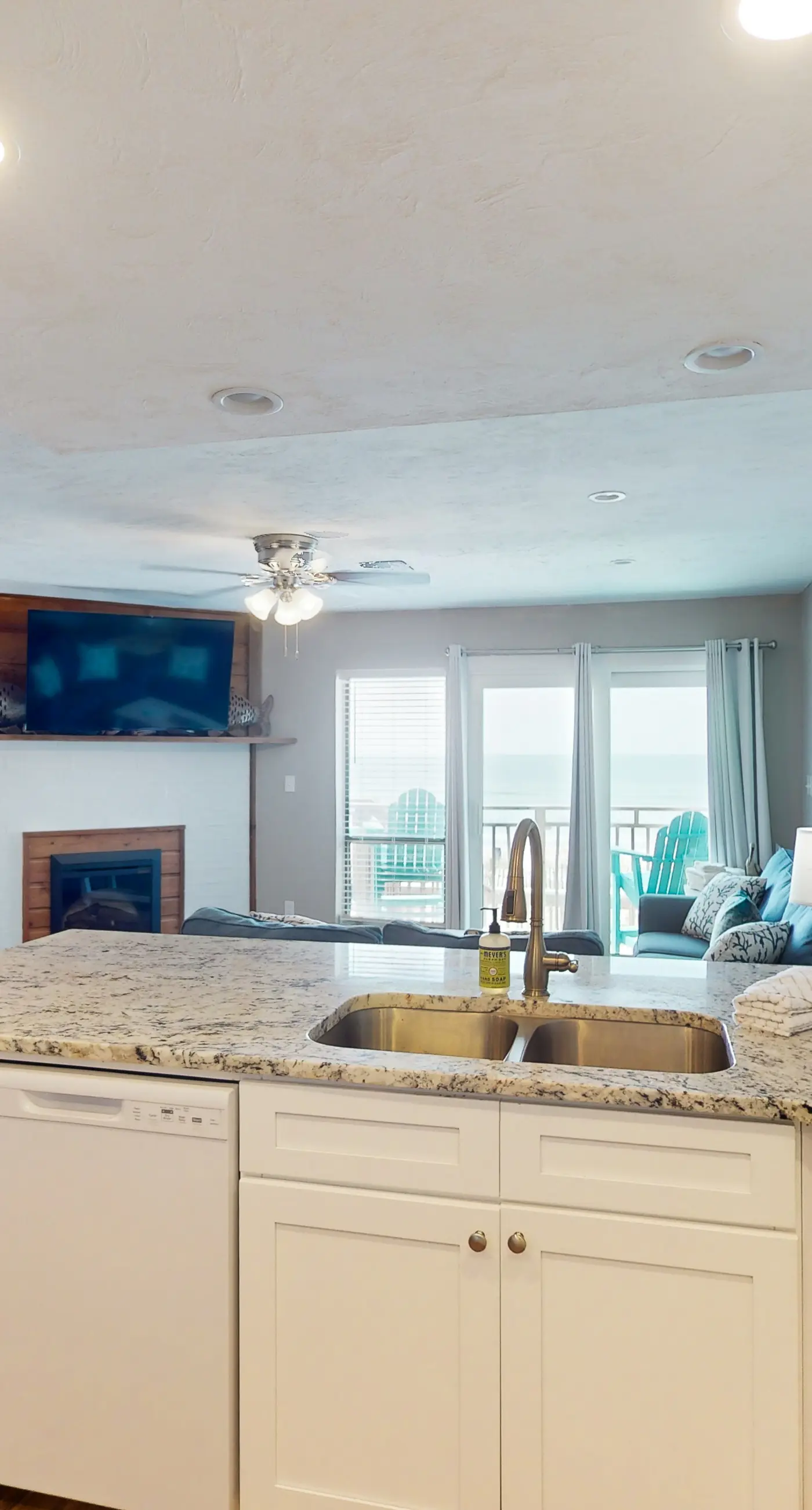 Beachfront East End townhouse with beach views, deck, on-site pool & grills