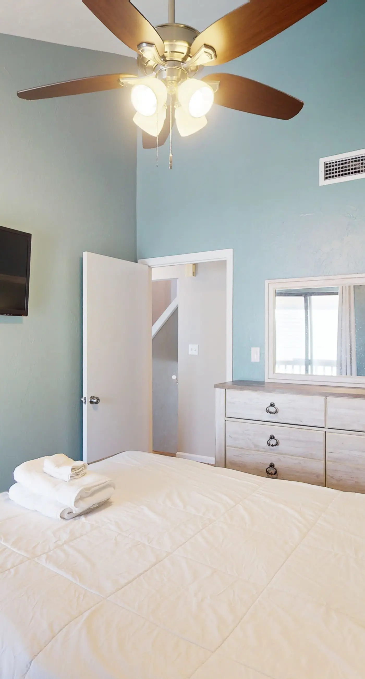 Beachfront East End townhouse with beach views, deck, on-site pool & grills