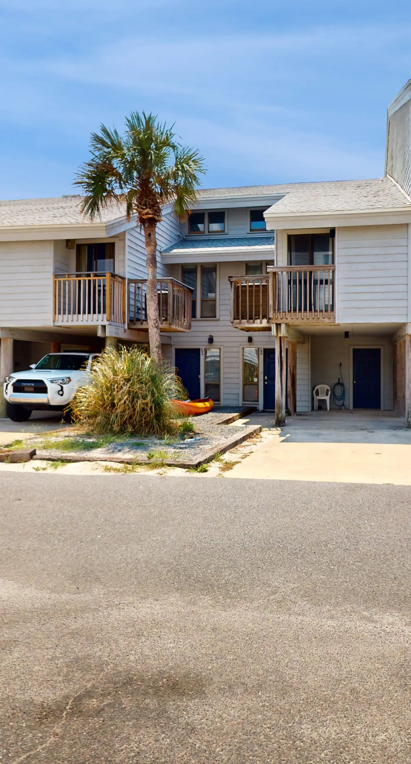 Beachfront East End townhouse with beach views, deck, on-site pool & grills