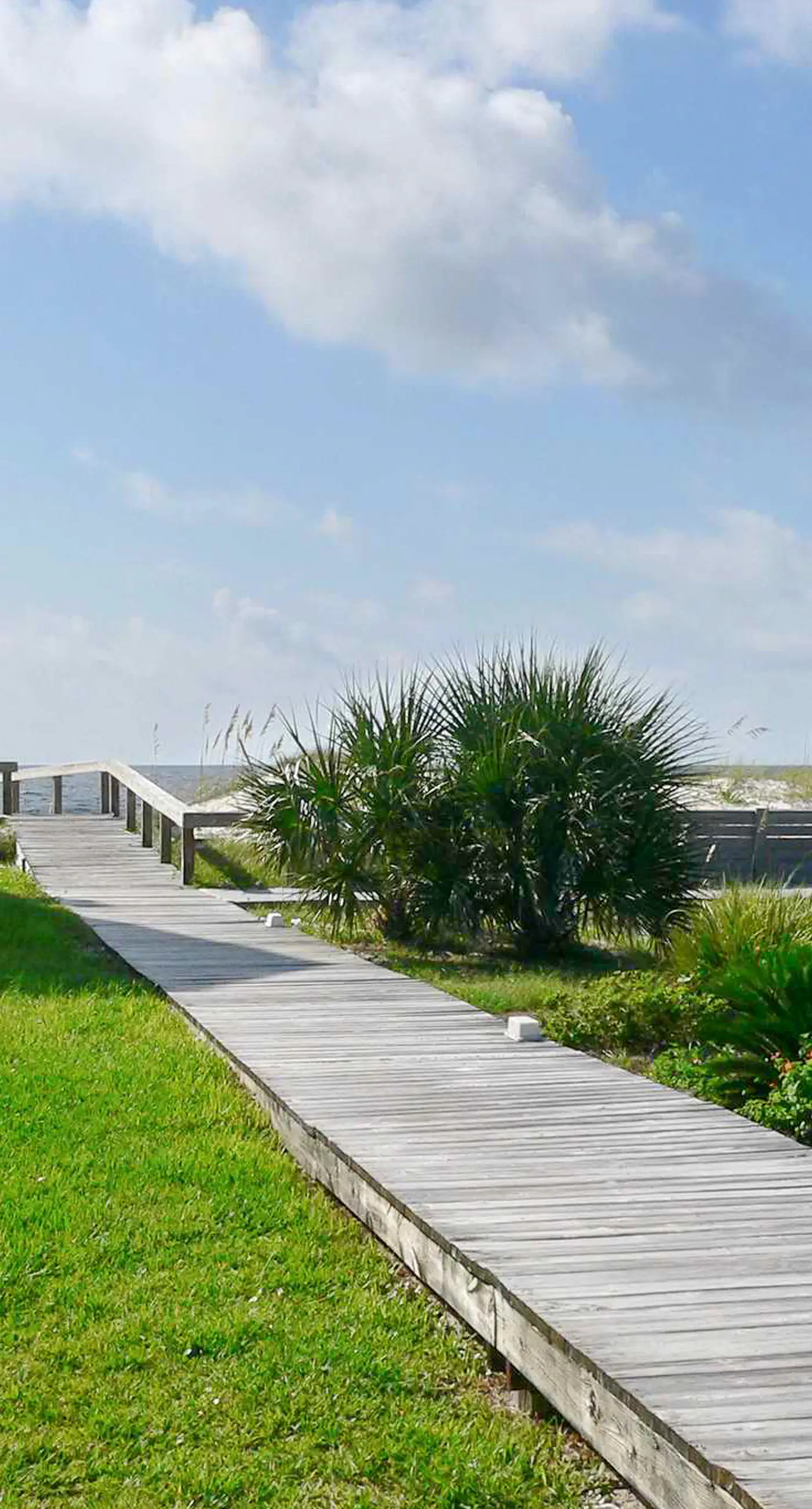 Beachfront East End townhouse with beach views, deck, on-site pool & grills