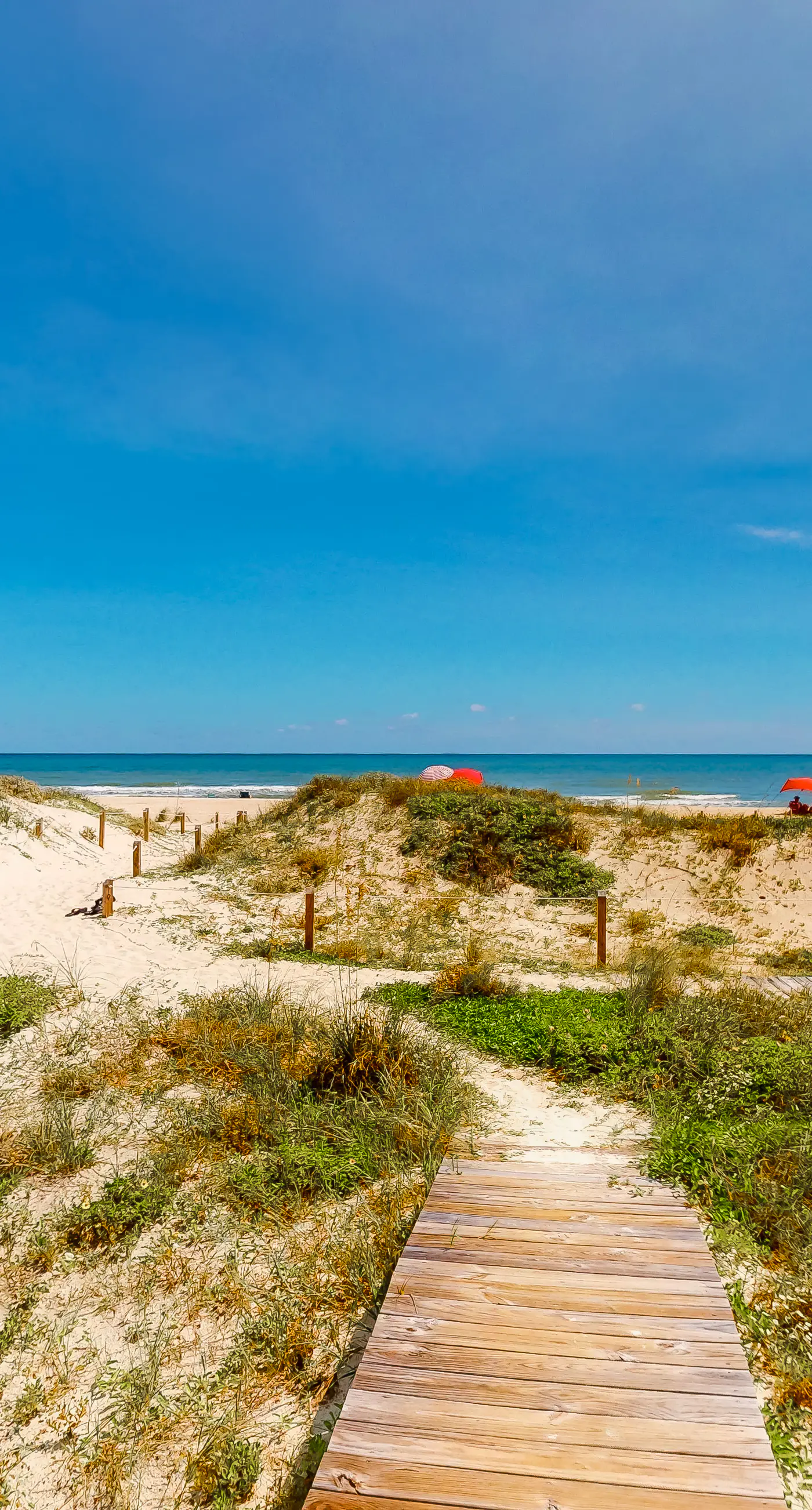 Dog-friendly beachfront home with private boardwalk, park style grill, deck, beach view