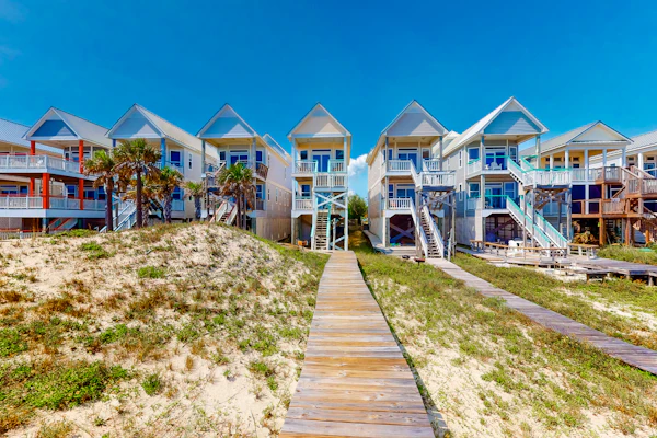 Dog-friendly beachfront home with private boardwalk, park style grill, deck, beach view