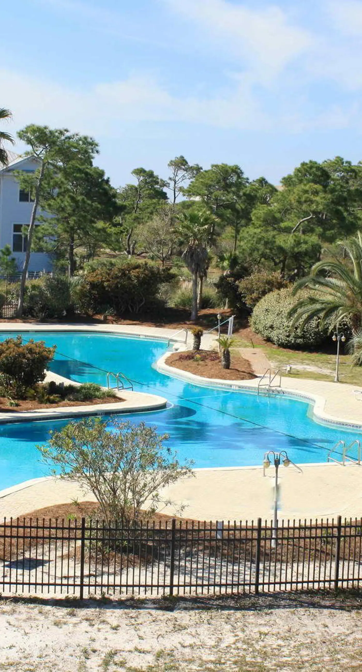 Spacious dog-friendly home with elevator, screened decks, on-site pool, & gym