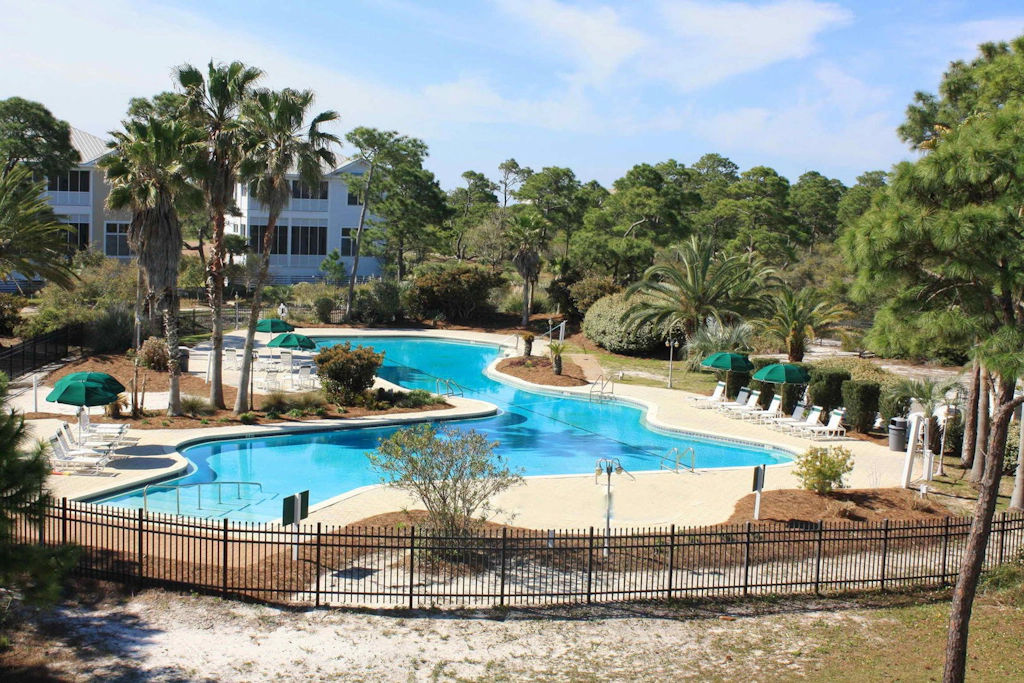 Spacious dog-friendly home with elevator, screened decks, on-site pool, & gym