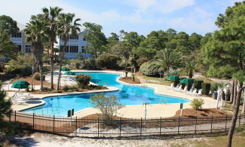 Spacious dog-friendly home with elevator, screened decks, on-site pool, & gym