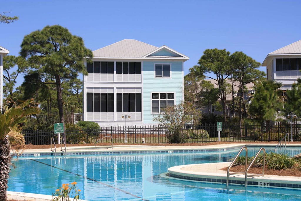 Spacious dog-friendly home with elevator, screened decks, on-site pool, & gym