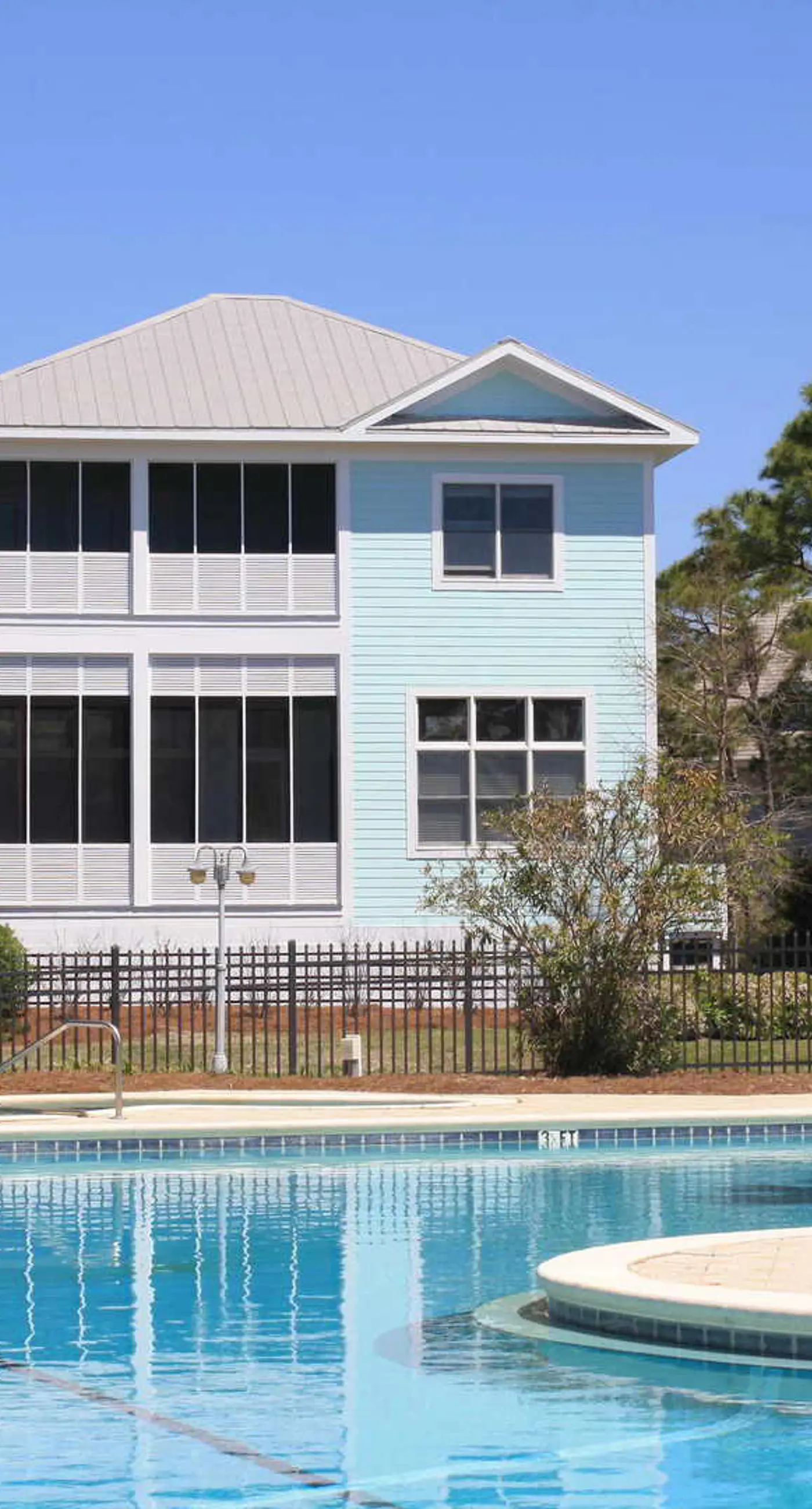 Spacious dog-friendly home with elevator, screened decks, on-site pool, & gym