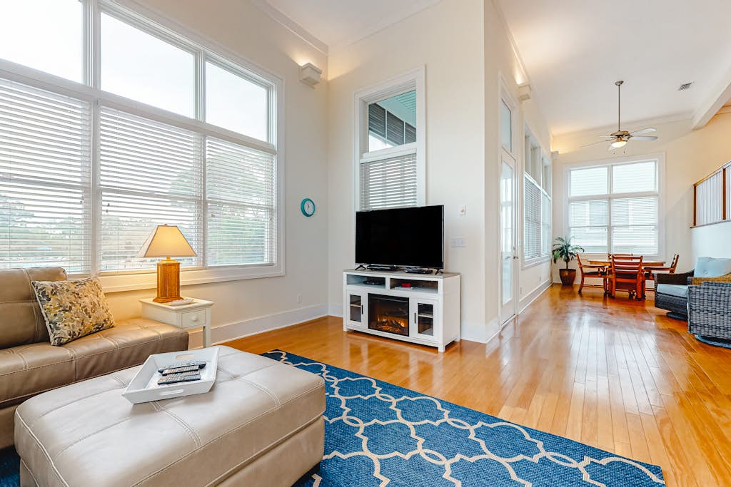 Spacious dog-friendly home with elevator, screened decks, on-site pool, & gym