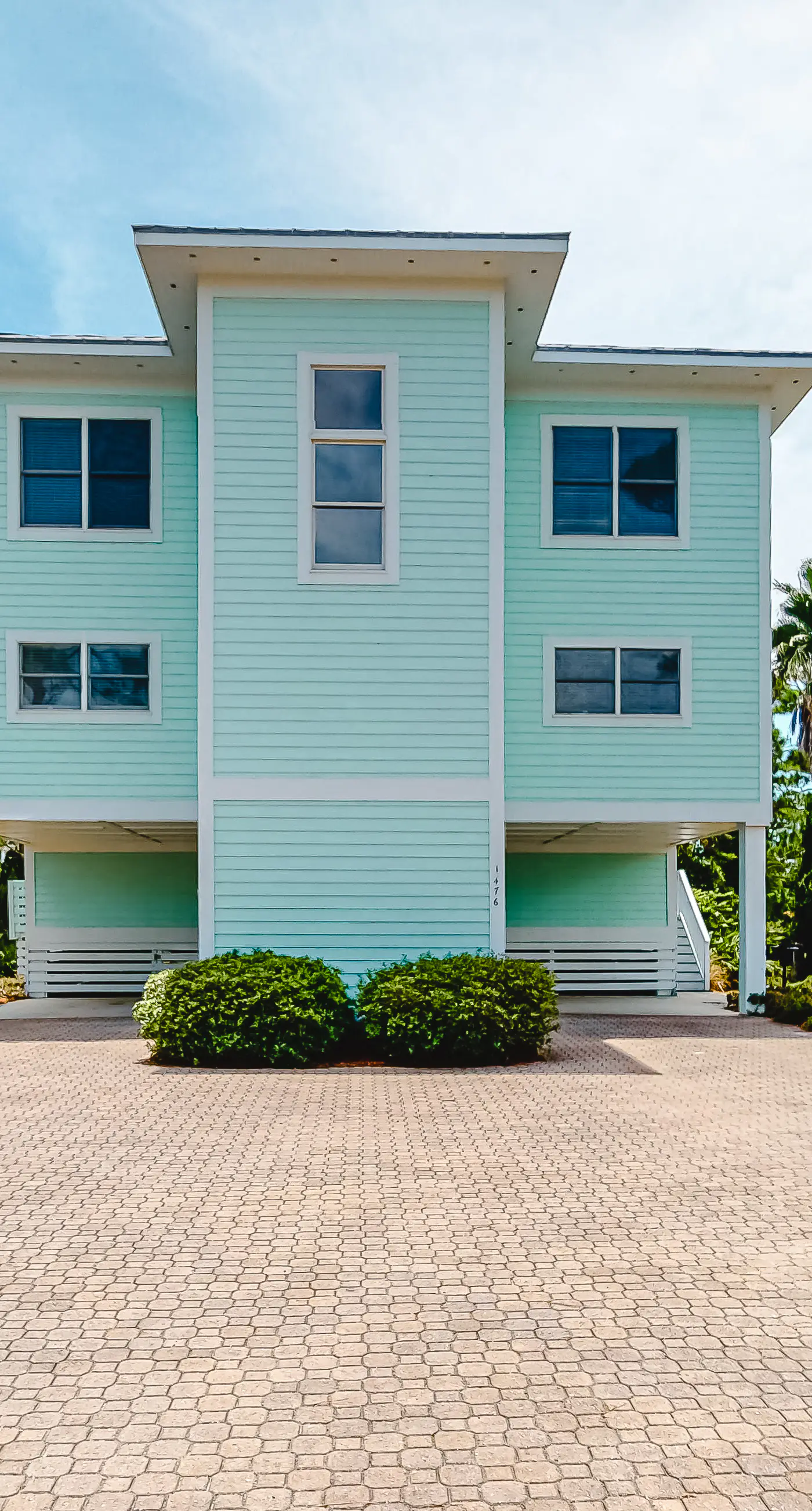 Spacious dog-friendly home with elevator, screened decks, on-site pool, & gym