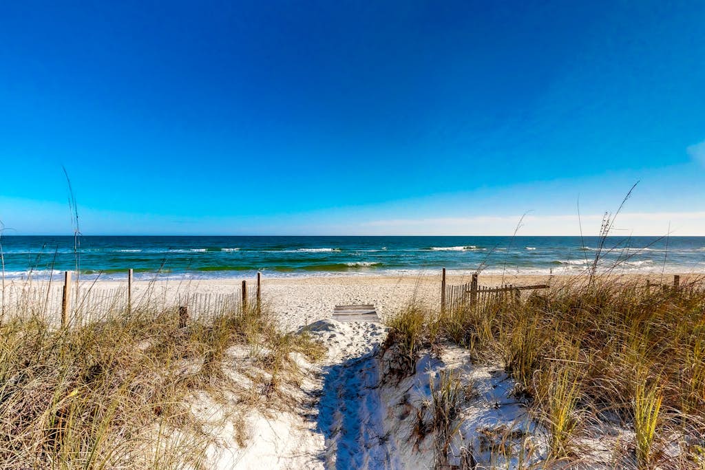 Sunny home with large deck, firepit, boat parking, W/D, & AC - easy beach access