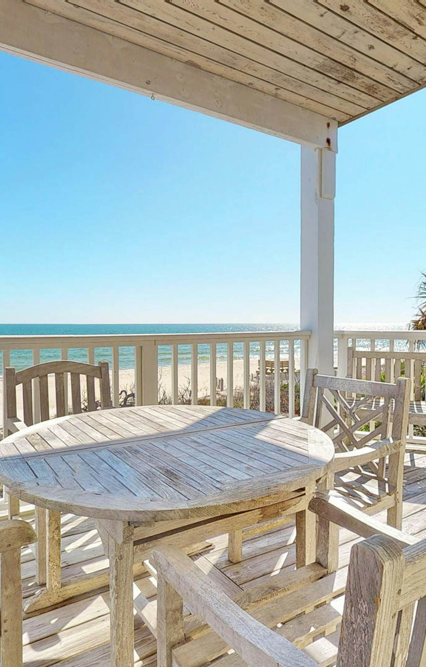 Upscale beachfront home with private hot tub, grill, on-site pools, gym, dogs OK