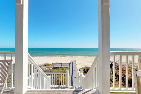 Upscale beachfront home with private hot tub, grill, on-site pools, gym, dogs OK