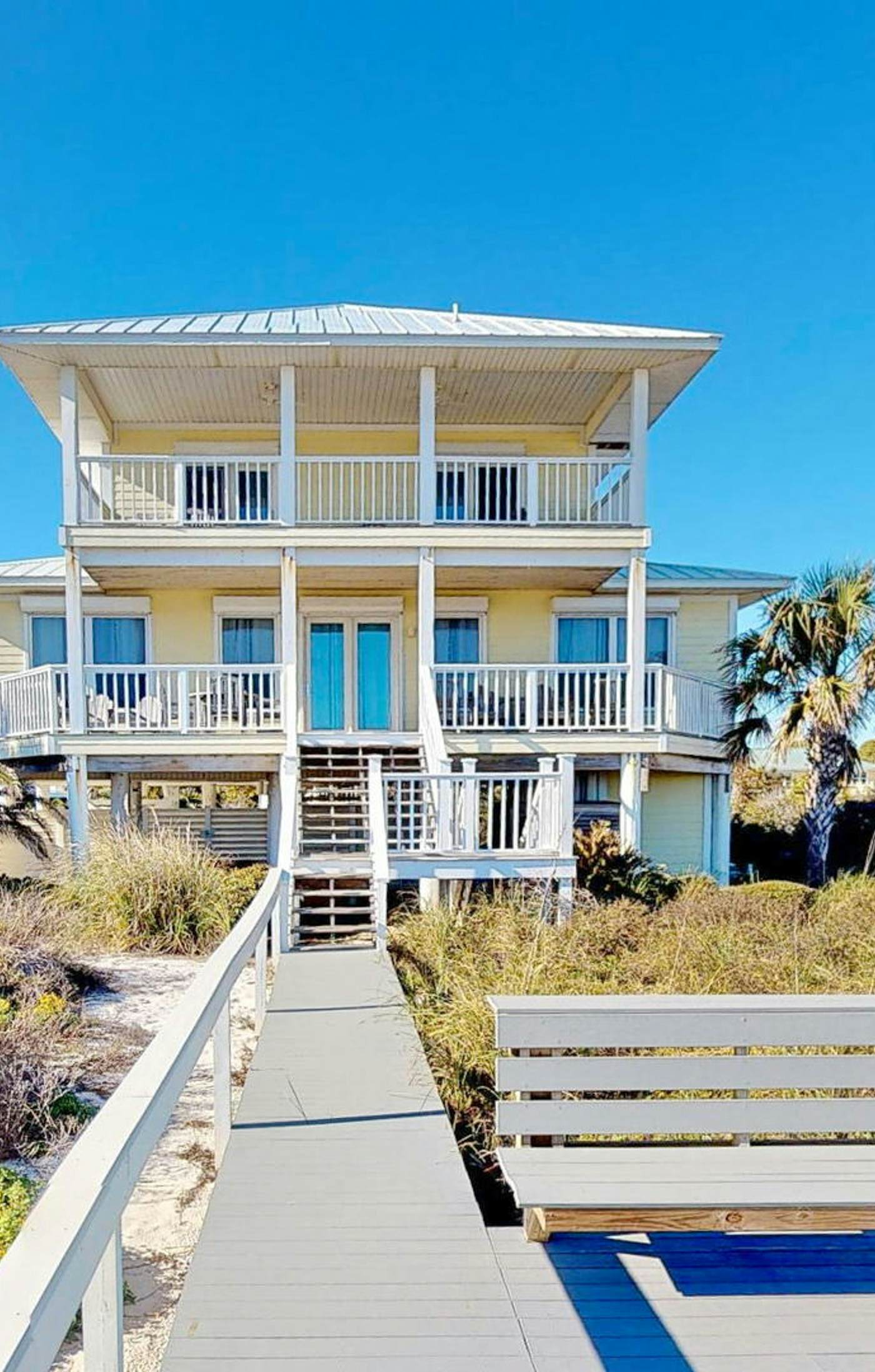 Upscale beachfront home with private hot tub, grill, on-site pools, gym, dogs OK