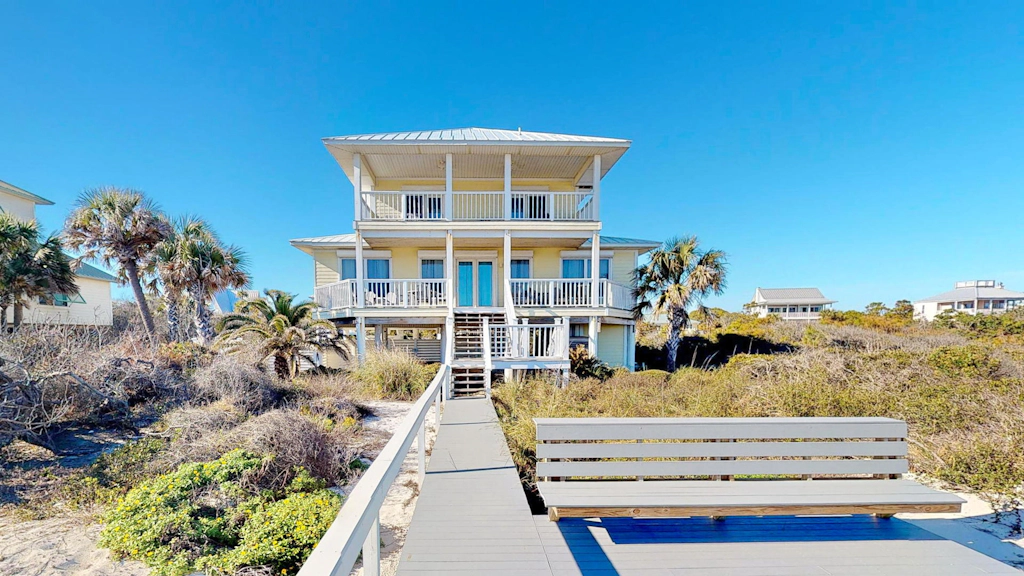 Upscale beachfront home with private hot tub, grill, on-site pools, gym, dogs OK