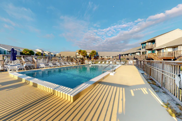 Inviting townhouse with on-site pool, updated interior, & W/D