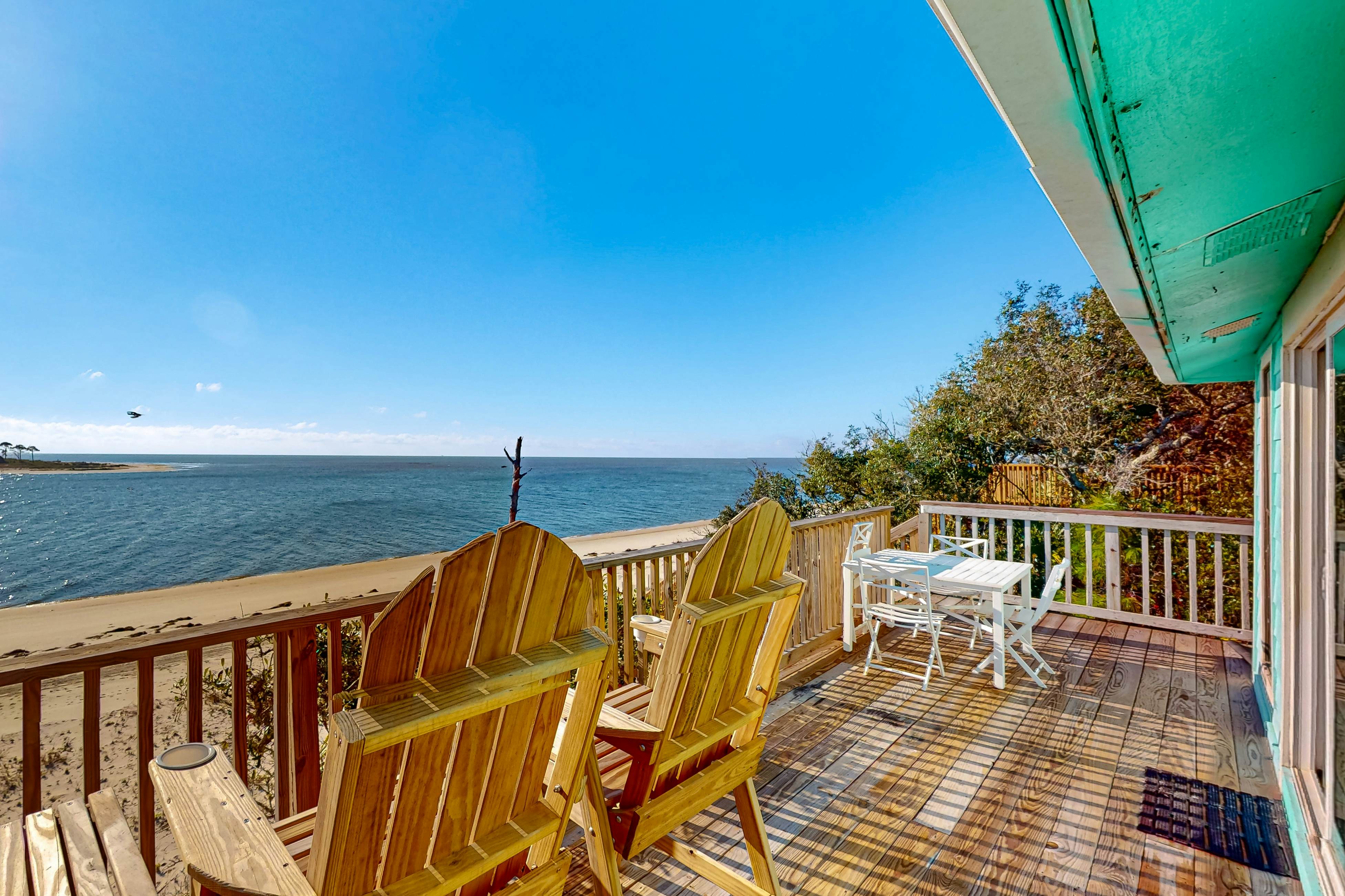 Beachfront dune cottage with deck & view of St Vincent Island