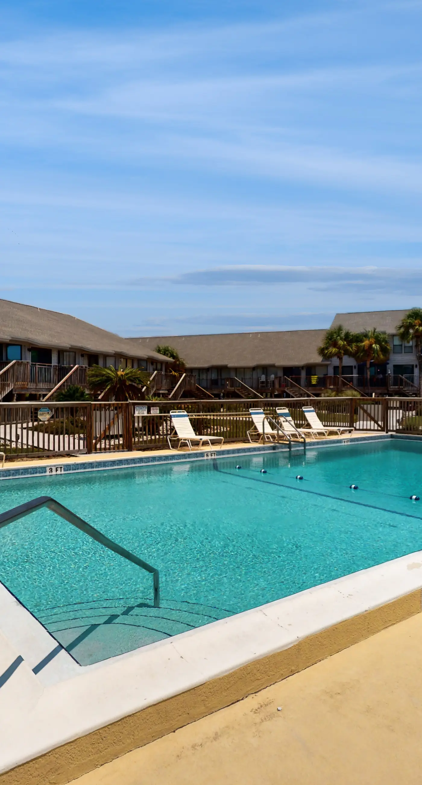 Comfortable townhome steps from beach with pool access, balcony, & W/D