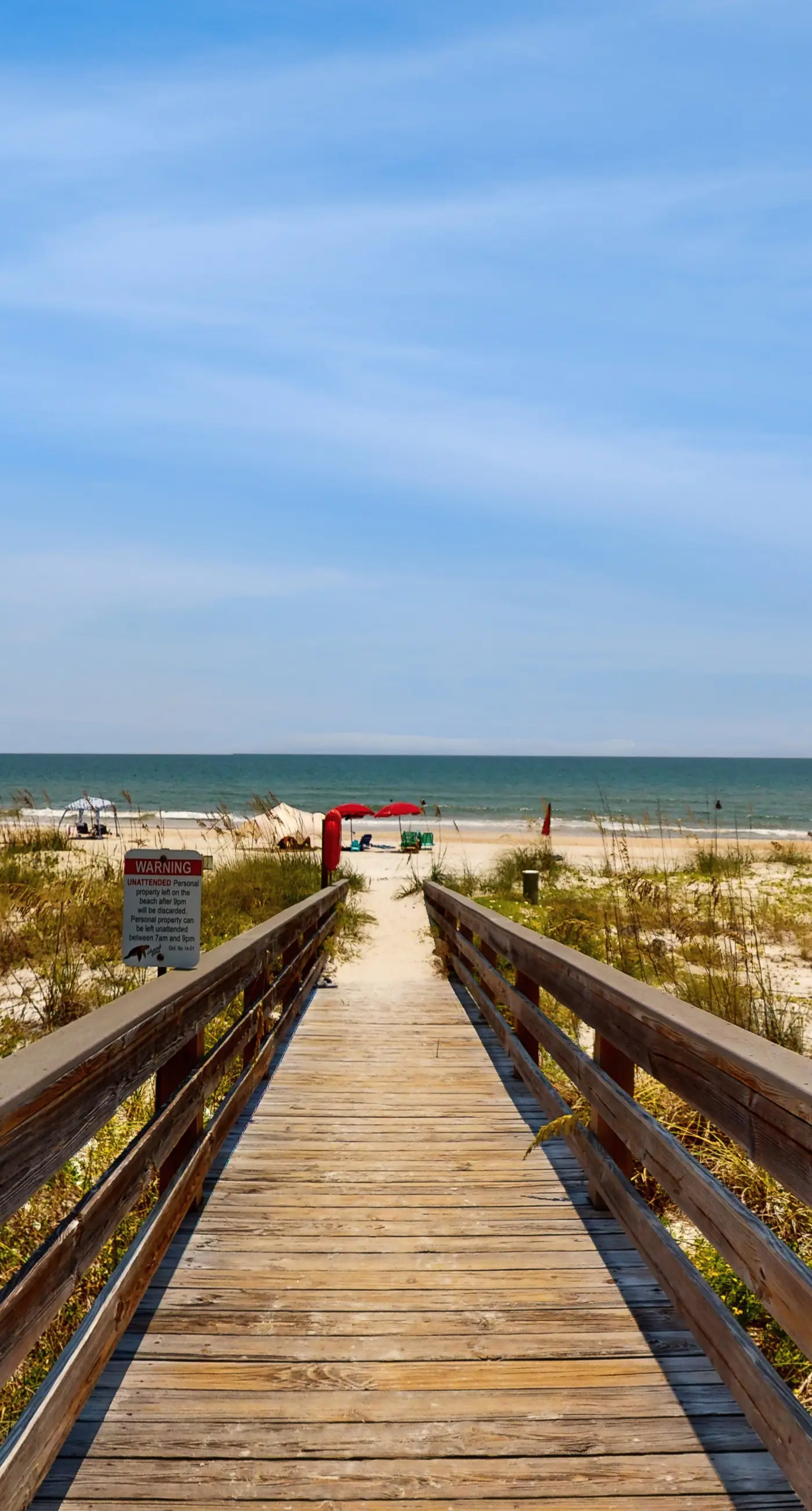 Comfortable townhome steps from beach with pool access, balcony, & W/D