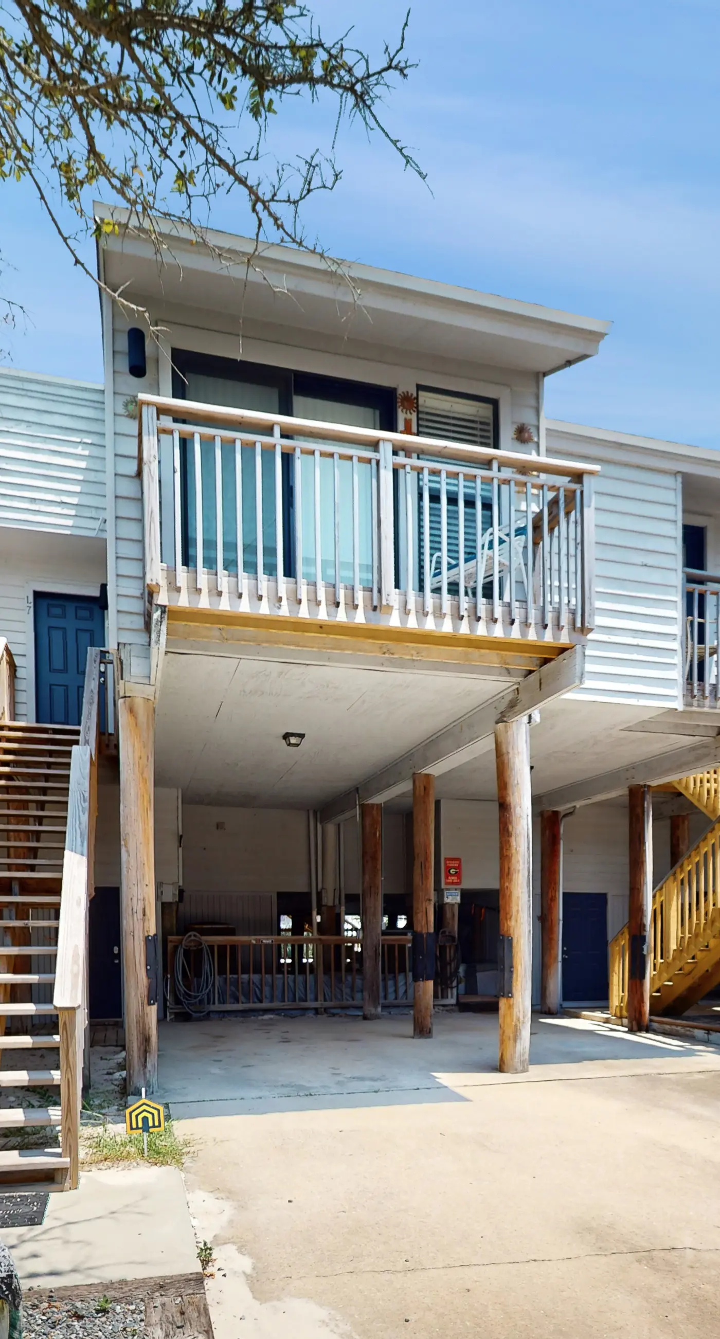 Comfortable townhome steps from beach with pool access, balcony, & W/D